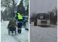 В непогоду инспекторы ДПС помогли женщине на инвалидной коляске и вытолкали автобус в Ростовской области