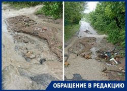 «Закопали бюджетные деньги»: пешеходов сбивают с ног сильные потоки воды на дороге в Ростове