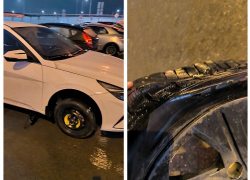 Жители Ростова пробивают колеса в ямах после ушедшего асфальта вместе со снегом